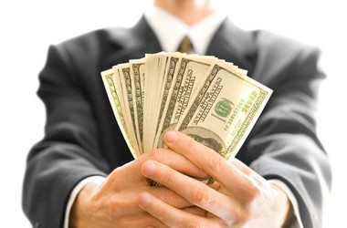 Sales Person Holding Money